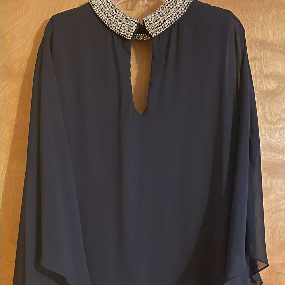 Elegant Black Cocktail Dress with jeweled neckline.